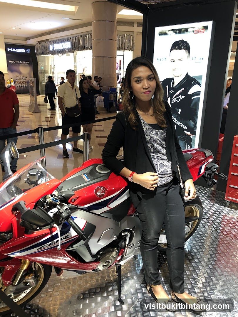 Woman Posing with a Motorcycle
