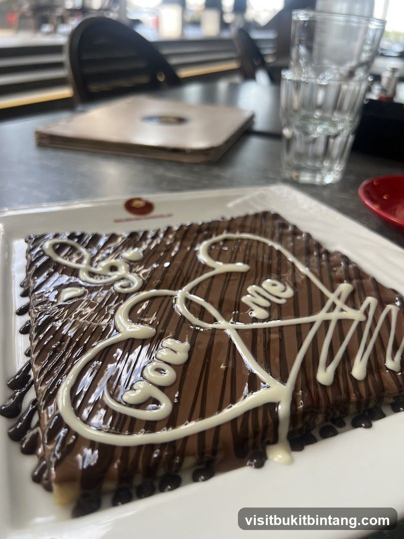 Chocolate Crepe with "Love Me" written in white icing