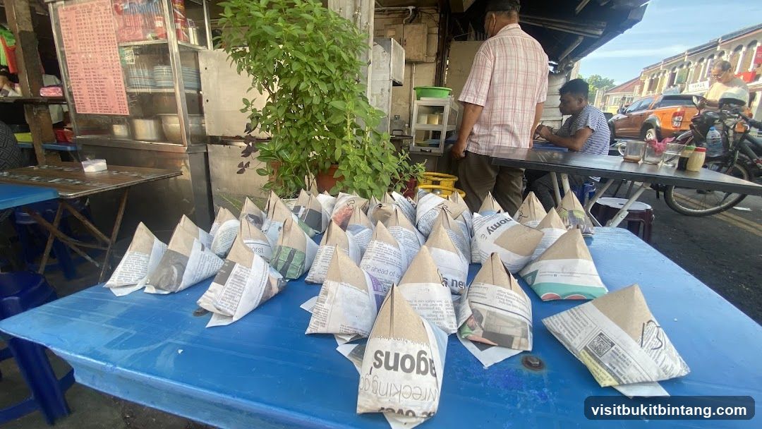 Food wrapped in newspaper on a table