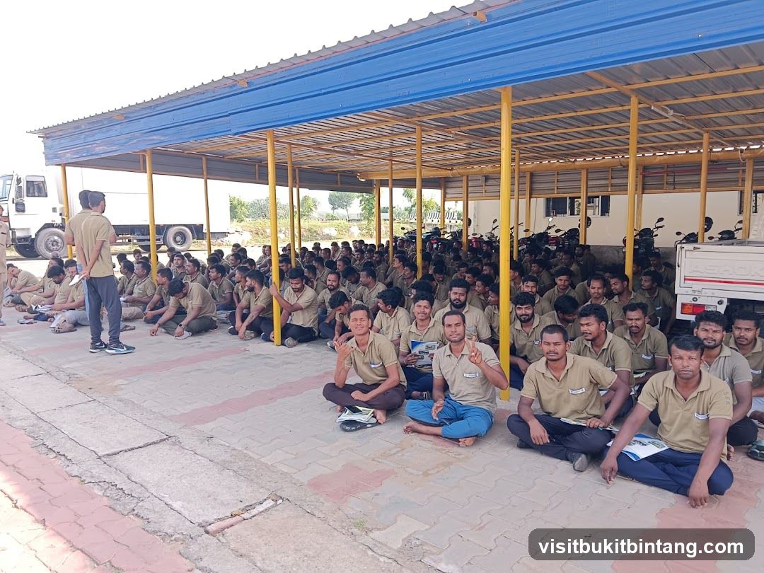 Group of men sitting under a covered area