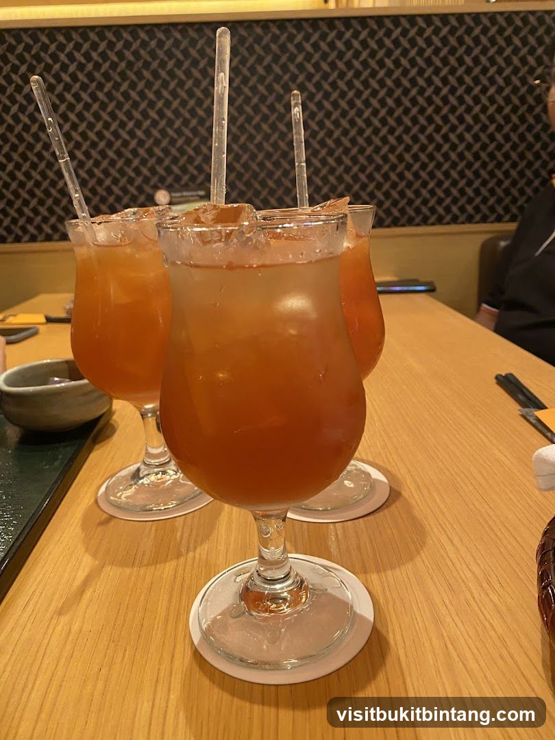 Three Orange Cocktails on a Table
