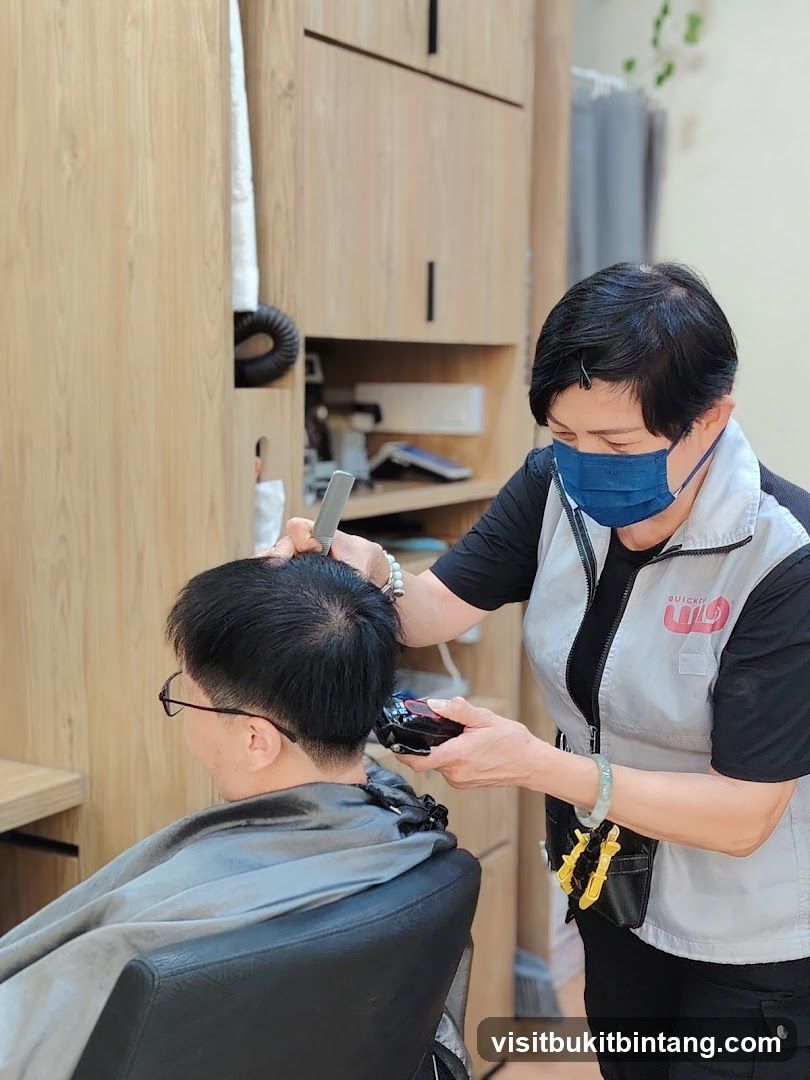 Hairdresser cutting client's hair