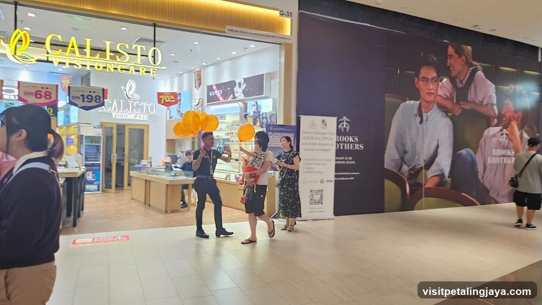 Shopping Mall Interior with Storefront and Advertisements