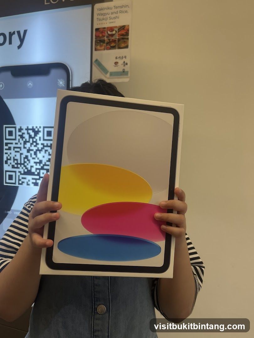 Person holding a tablet box