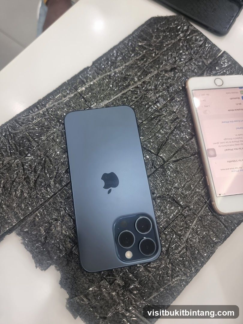 Two iPhones on a textured surface