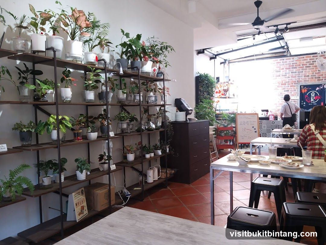Interior of a cafe with plants and tables