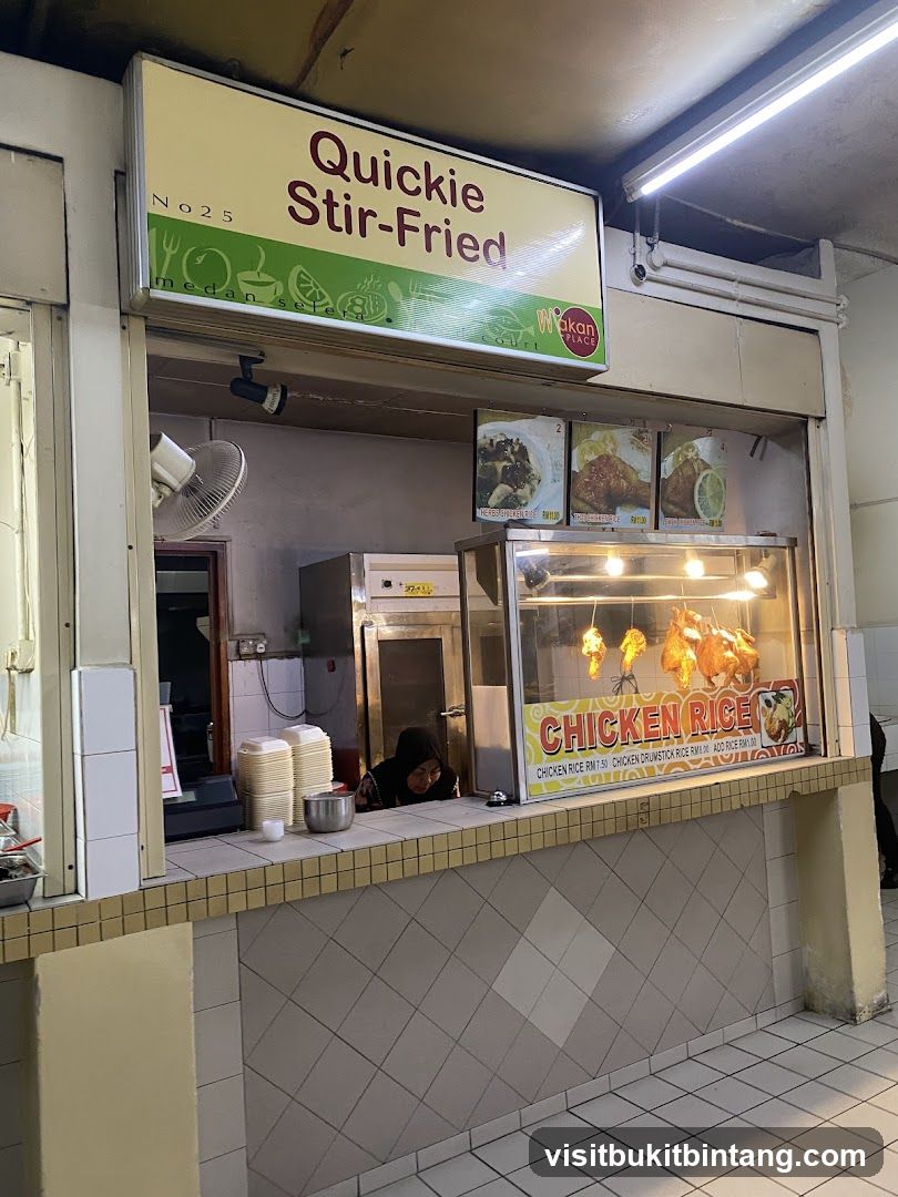 Food stall with chicken rice and stir-fried dishes