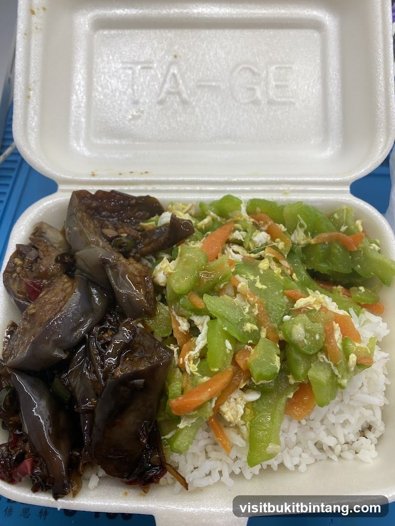 Takeout Container with Rice and Two Dishes