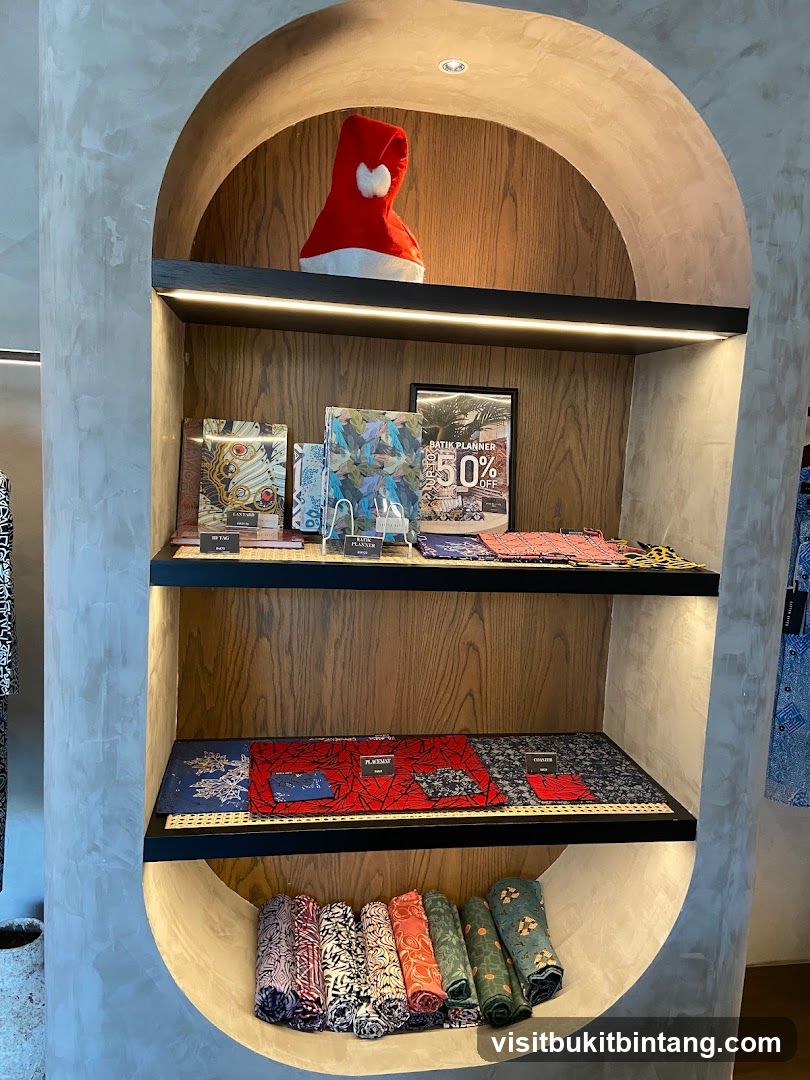 Display shelf with batik items and a Santa hat