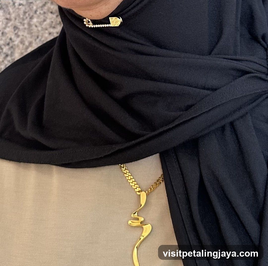 Gold Jewelry and Black Scarf