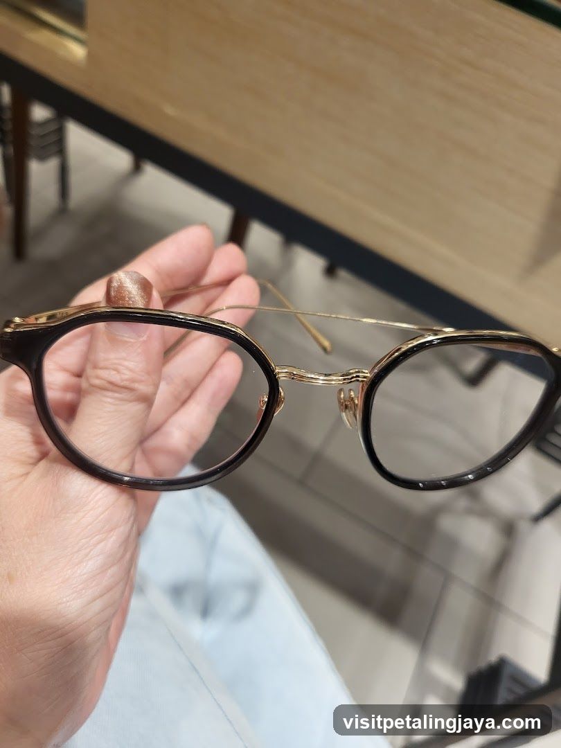 Eyeglasses held in hand