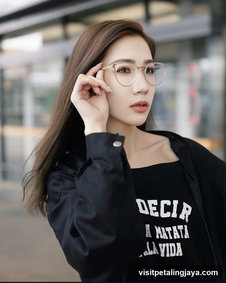 Woman with glasses and black shirt