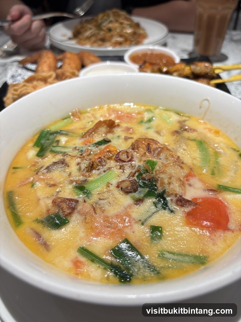 Bowl of Soup with Various Dishes
