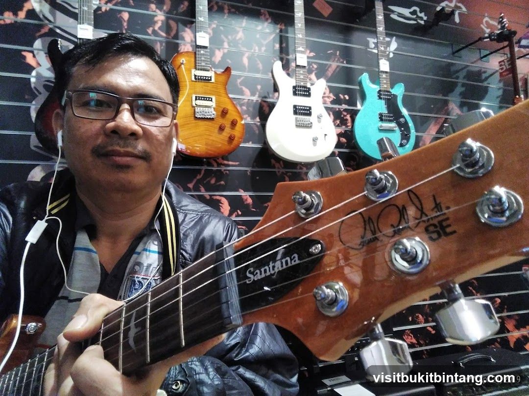 Man holding a guitar