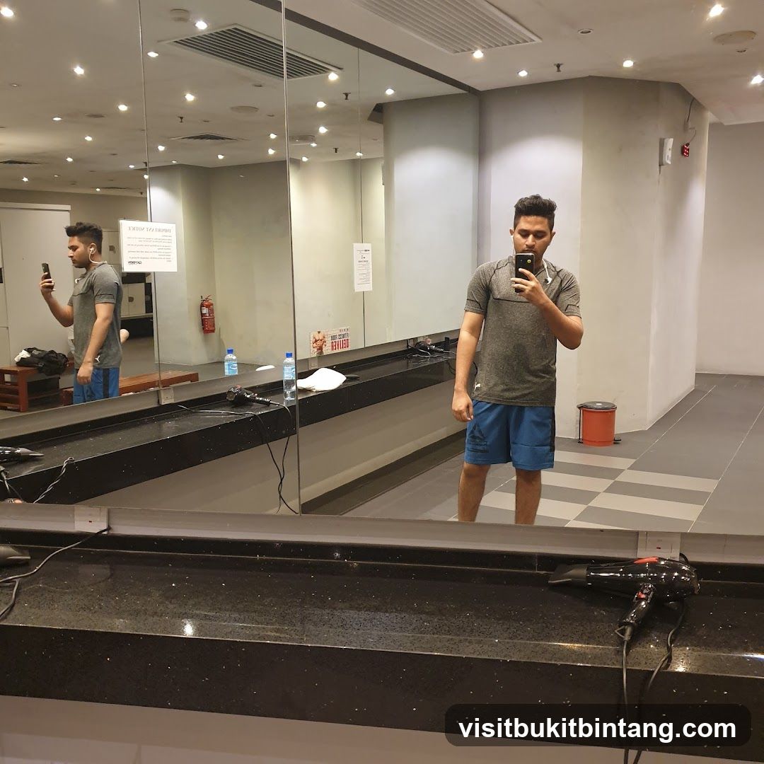 Man taking a selfie in a gym locker room