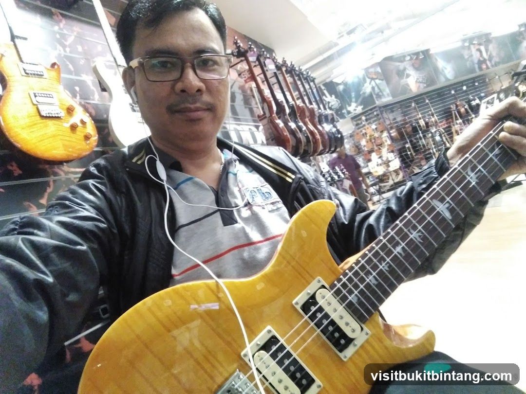 Man holding a guitar