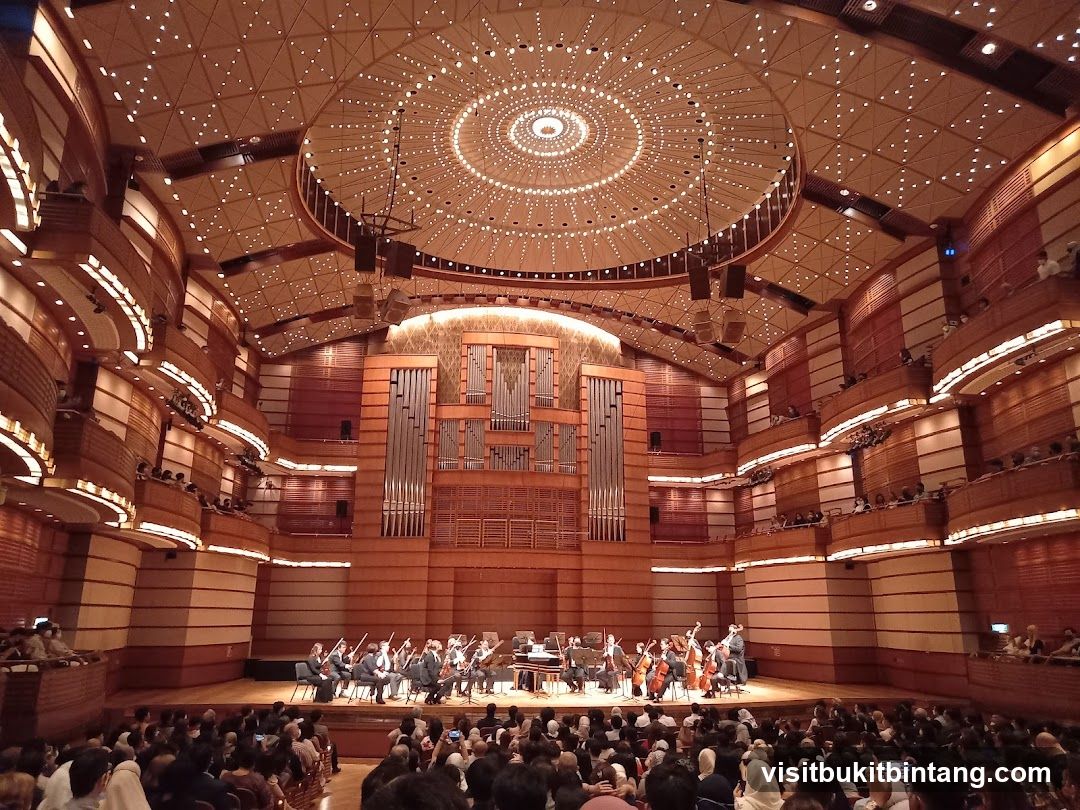 Orchestra performing in a concert hall