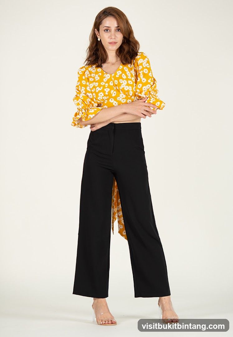 Woman in Yellow Floral Top and Black Wide-Leg Pants