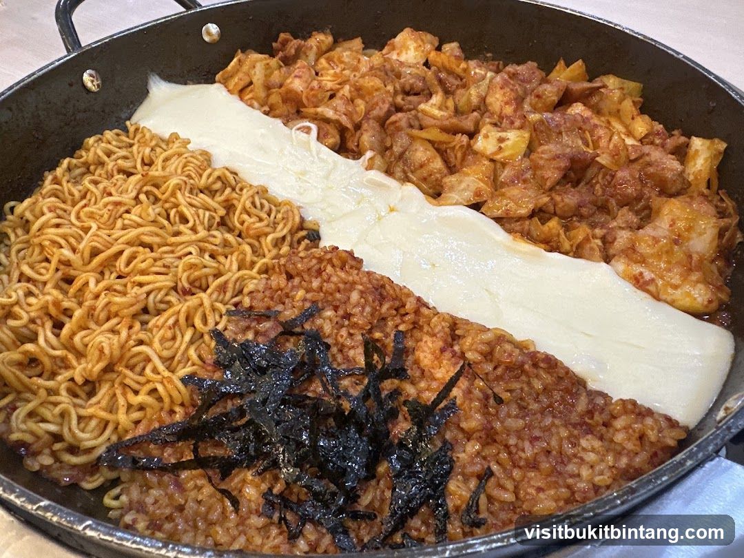 Spicy Stir-Fried Chicken with Cheese and Noodles