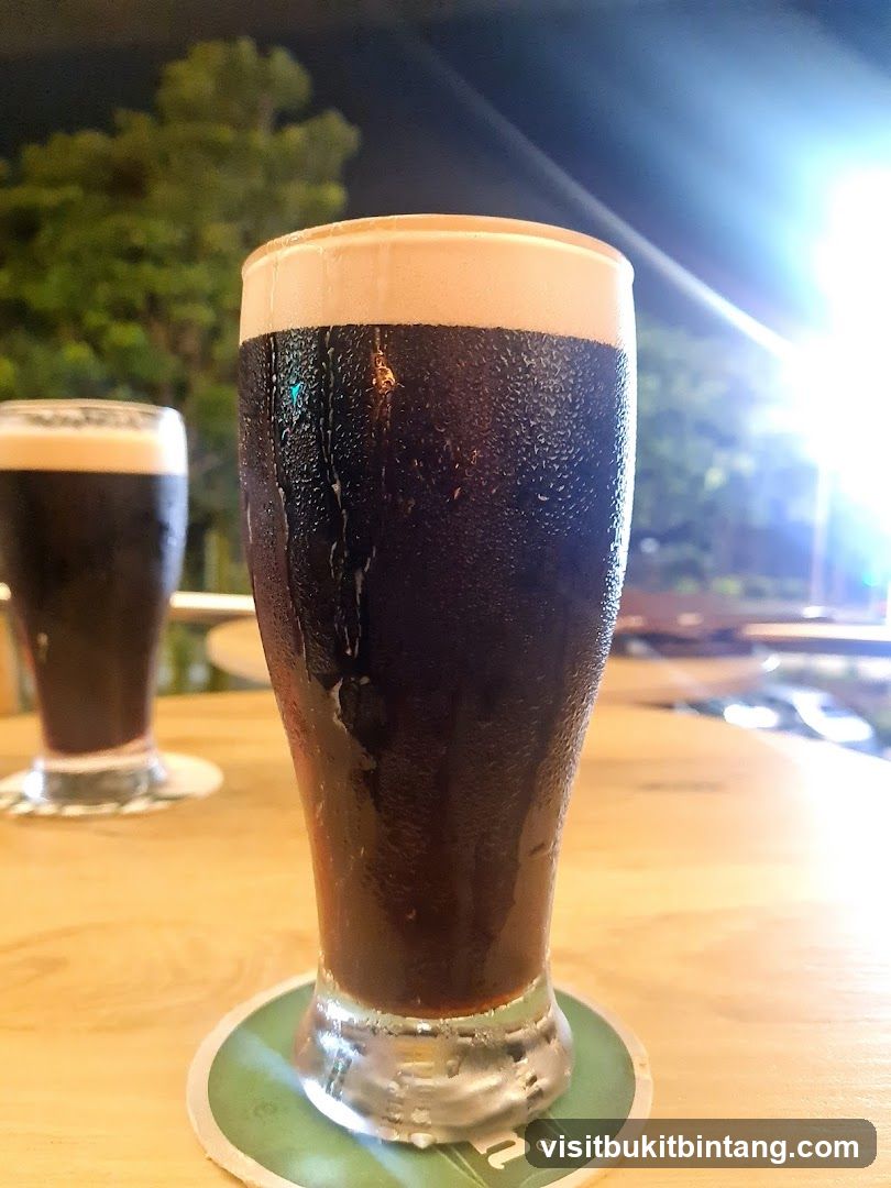 Two glasses of dark beer