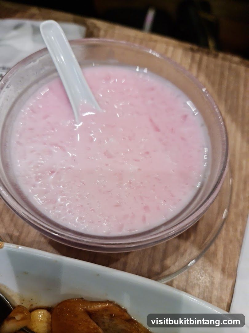 Pink dessert with spoon