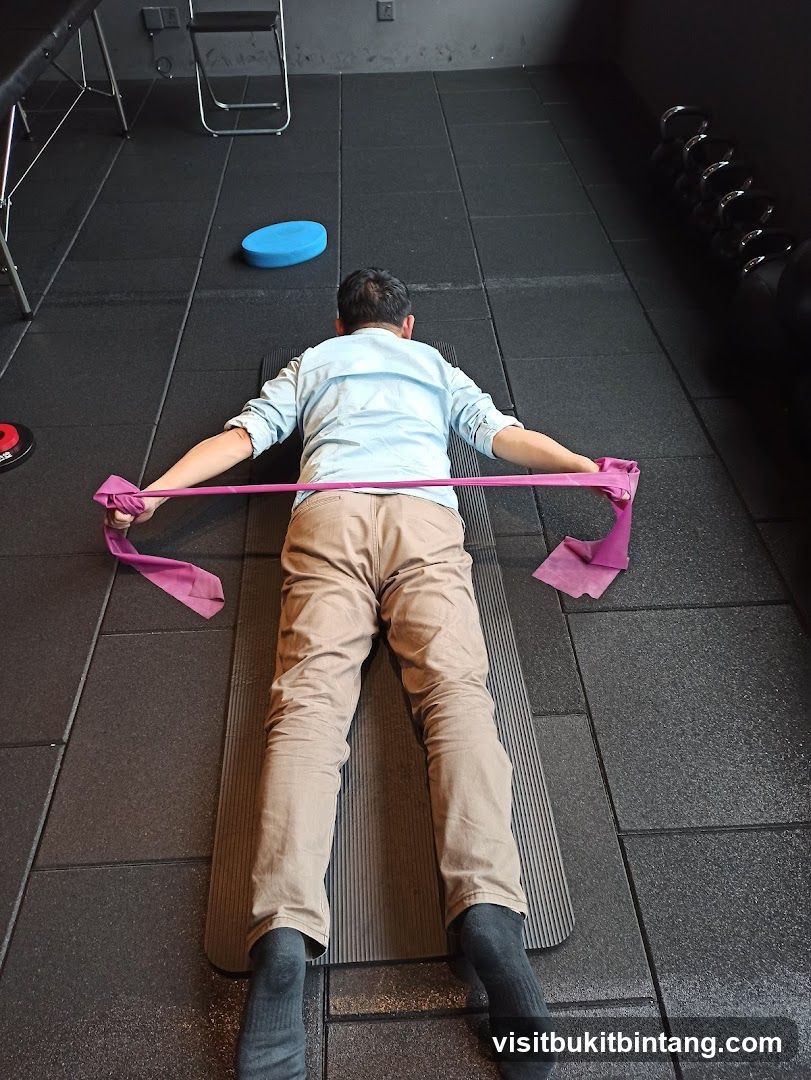 Man exercising with resistance band