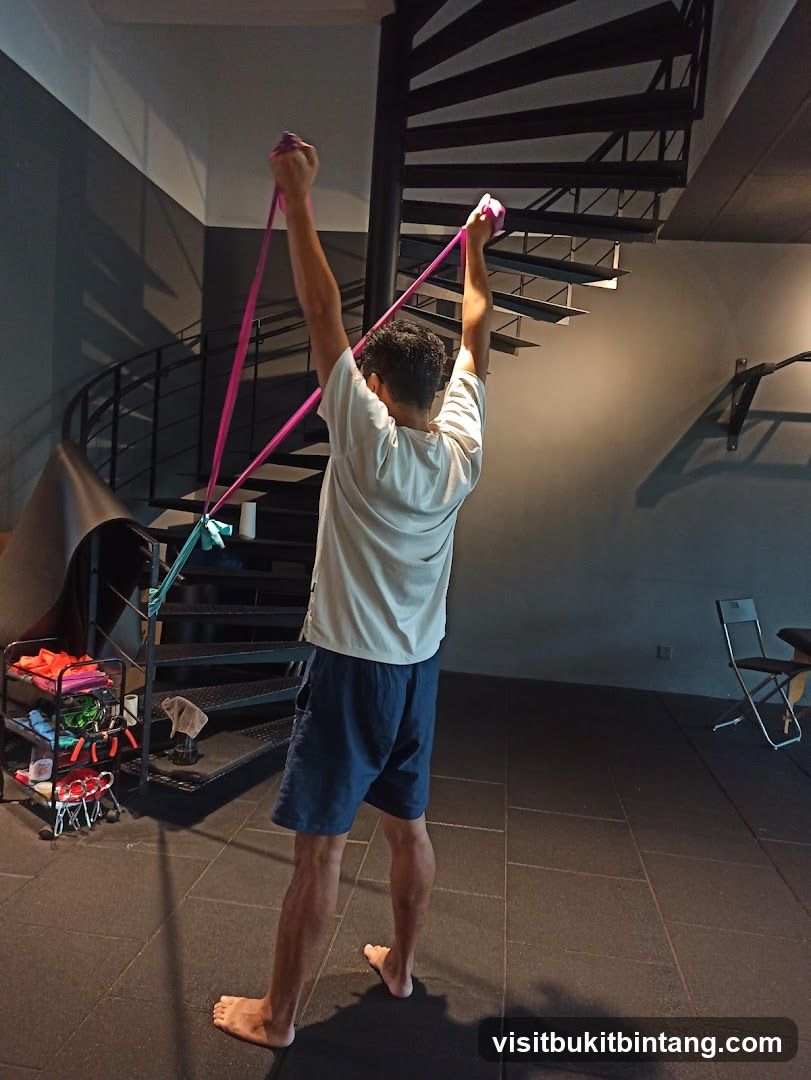 Man exercising with resistance bands