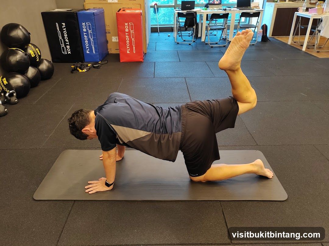 Man exercising on a mat
