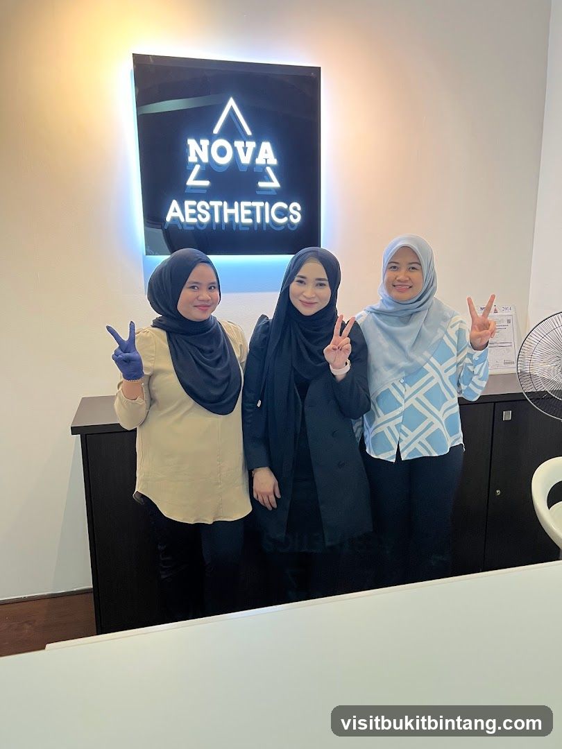Three women posing in front of a sign