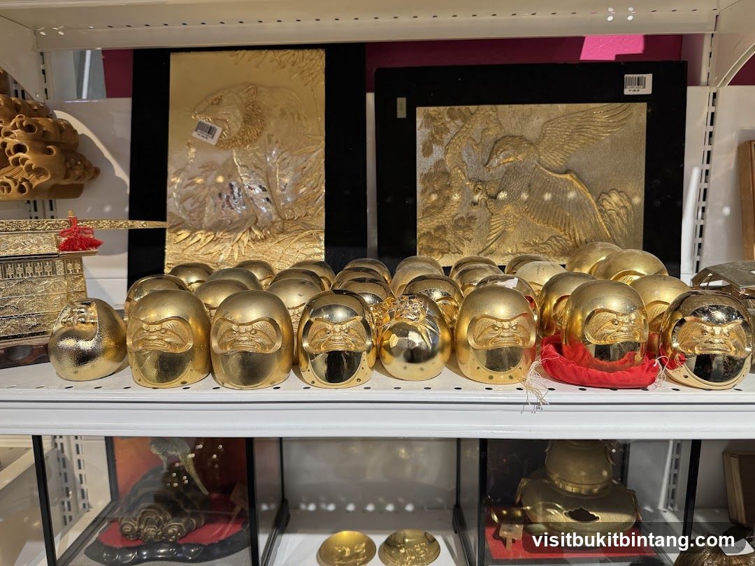 Golden Daruma Dolls and Artwork