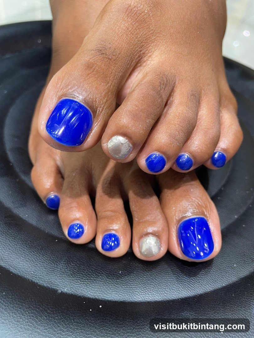 Toes with Blue and Silver Nail Polish