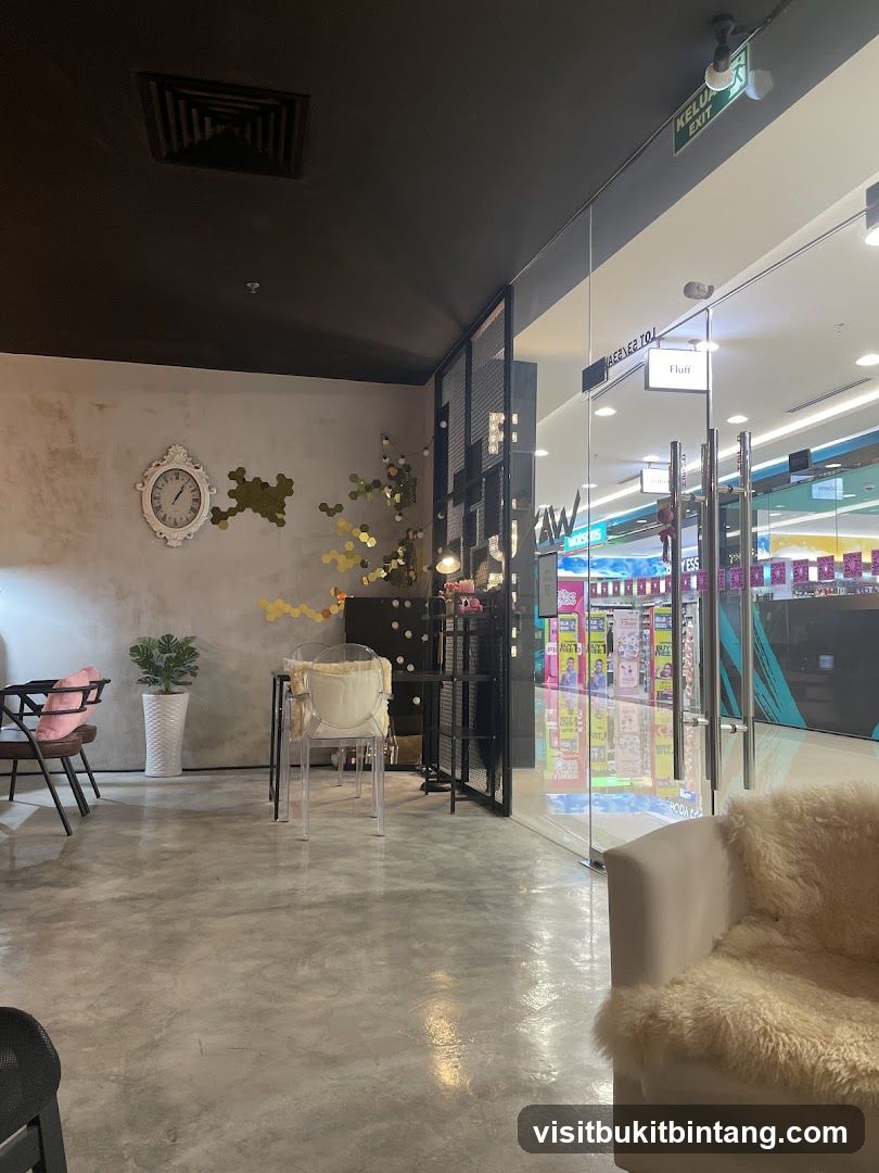 Interior of a modern cafe with seating and a view into a retail store