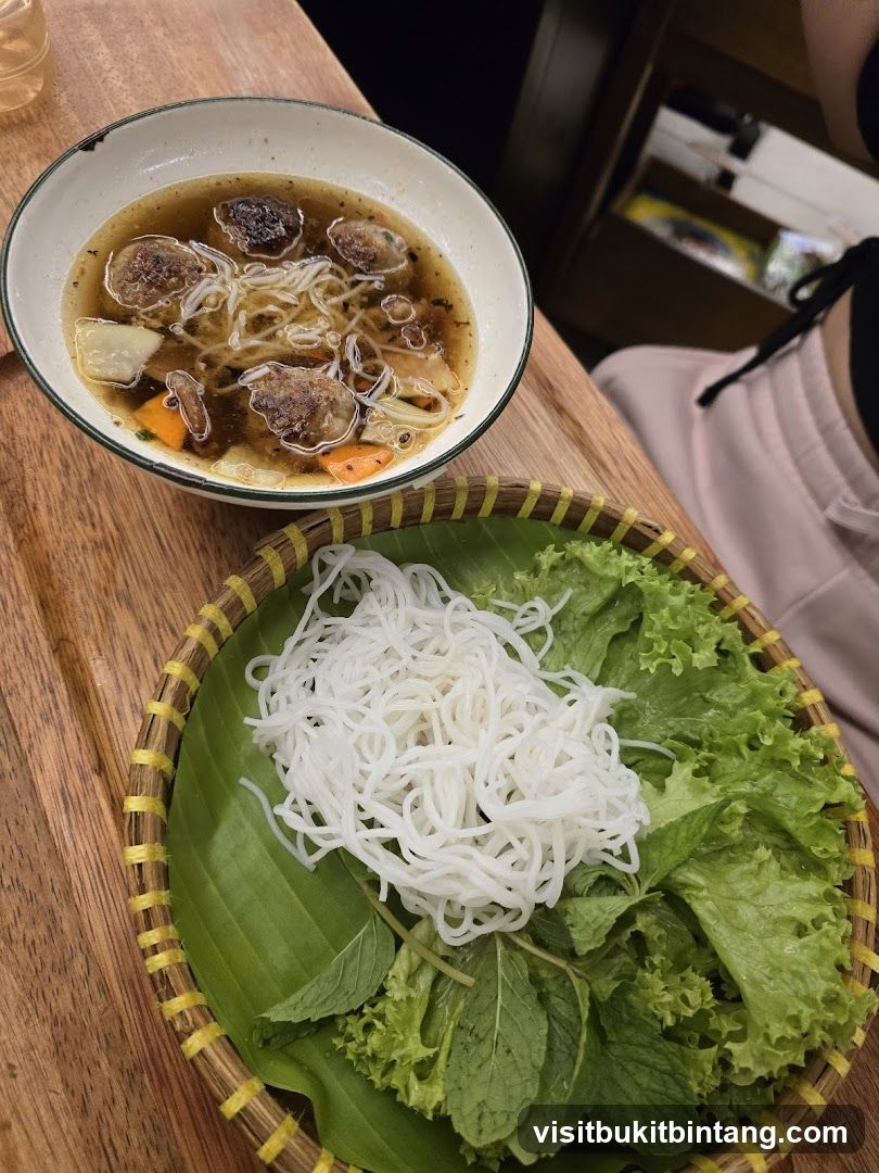 Vietnamese Noodle Soup with Meatballs and Fresh Greens