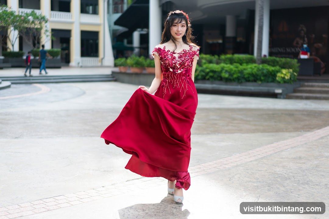 Woman in Red Dress Posing Outdoors