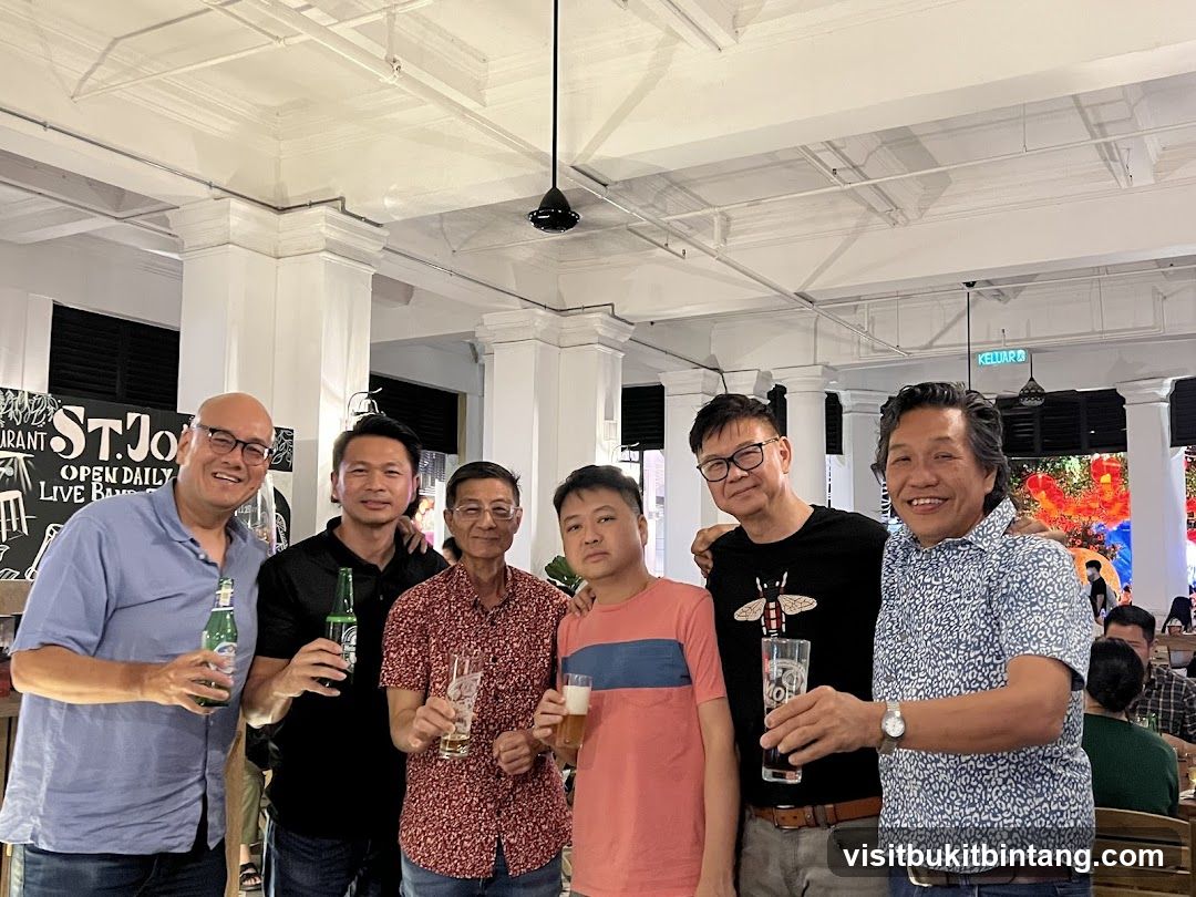 Group of men holding drinks