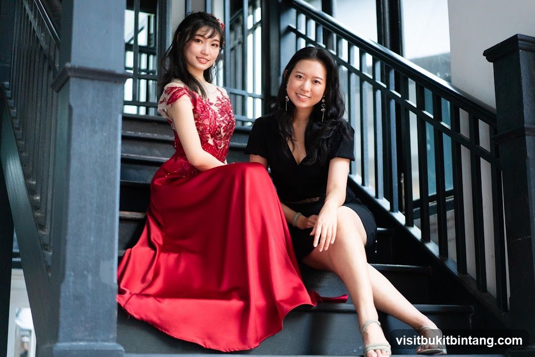 Two women posing on stairs