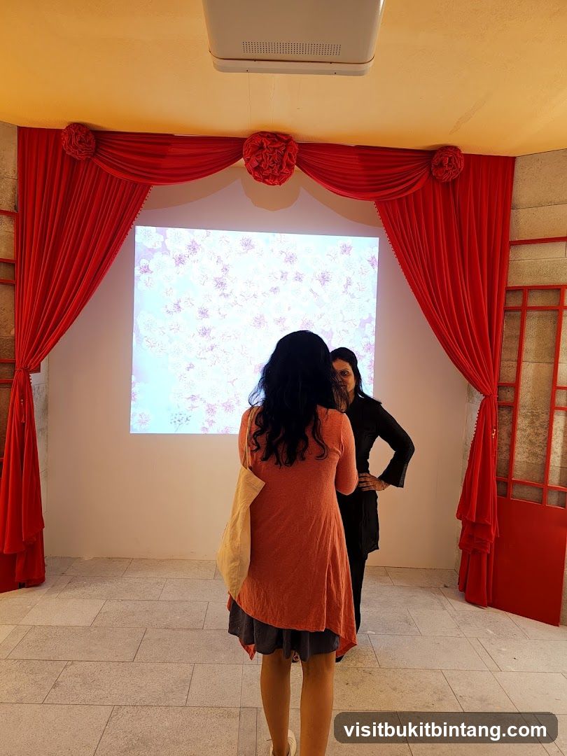 Two women in front of a projected image