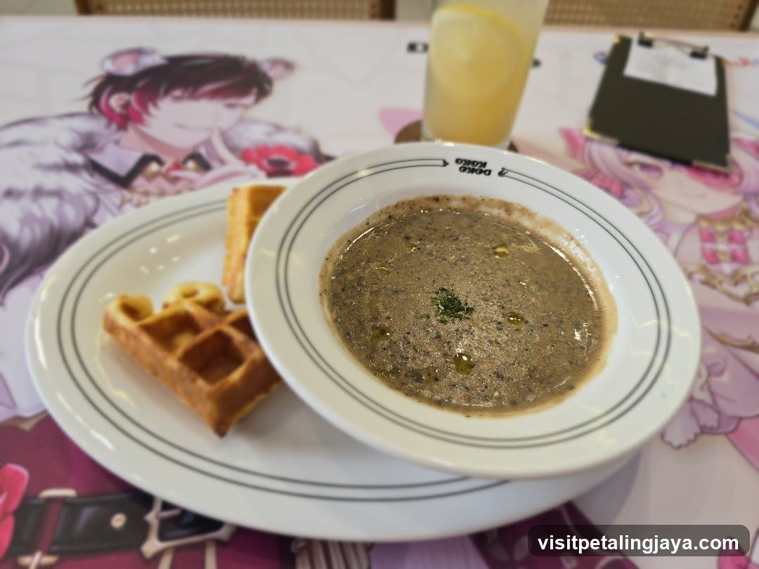 Anime-themed table setting with soup and waffles
