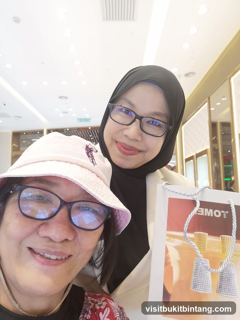 Two Women Posing with a Shopping Bag