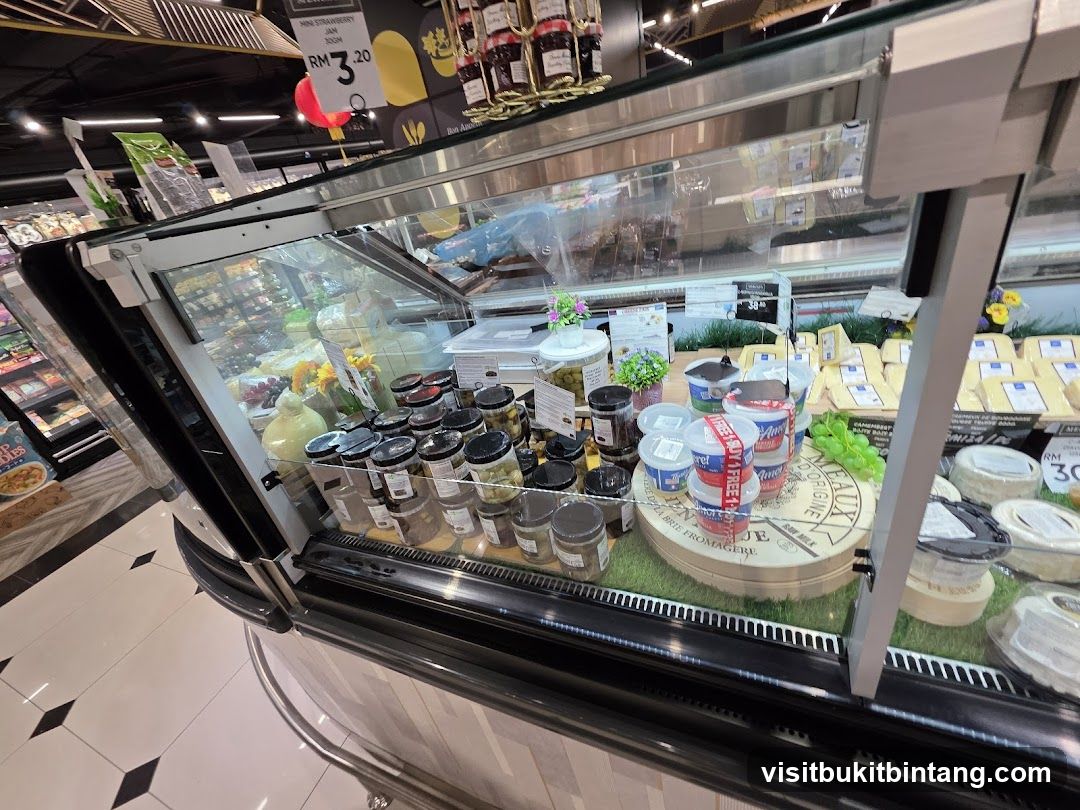 Refrigerated Display Case with Cheeses and Jars