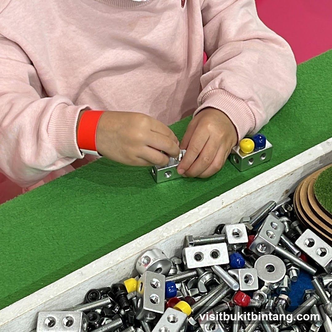 Child playing with construction toys