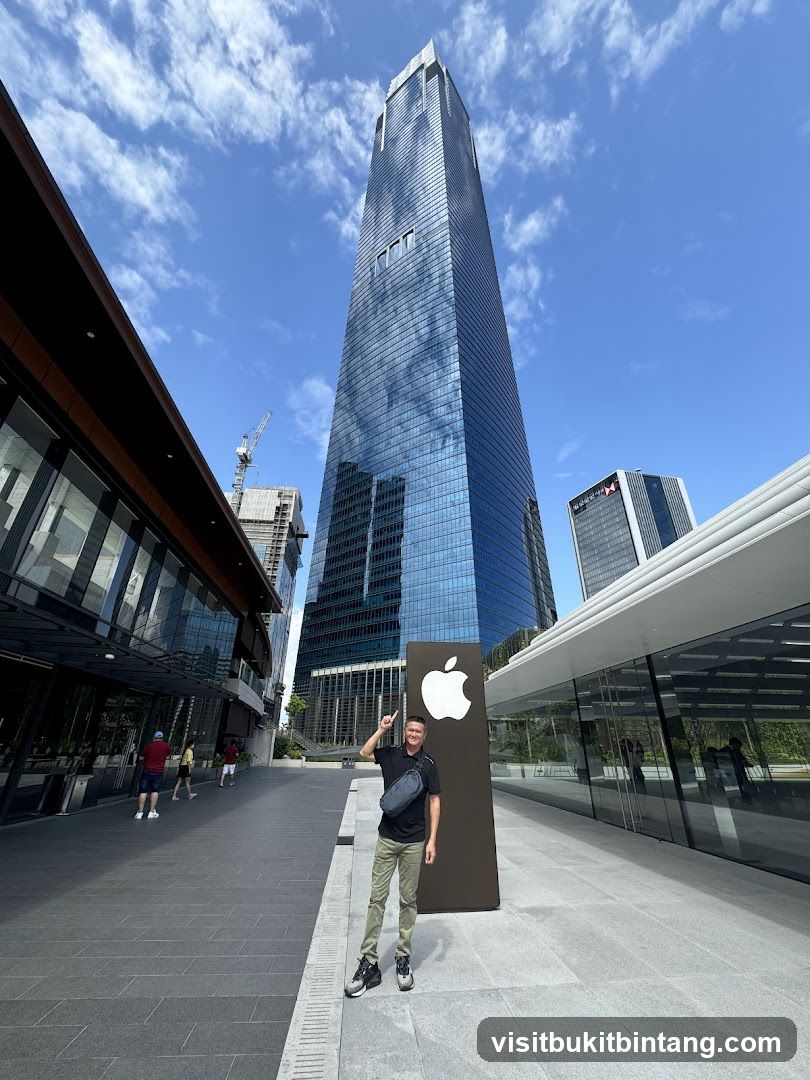 Man Posing by Apple Store Entrance