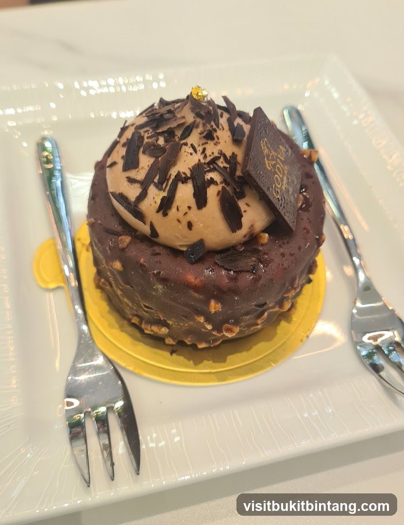Chocolate Cake with Gold Leaf and Godiva Chocolate Square