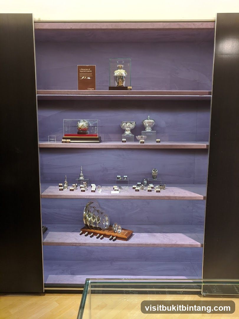 Display case with ornate silver items