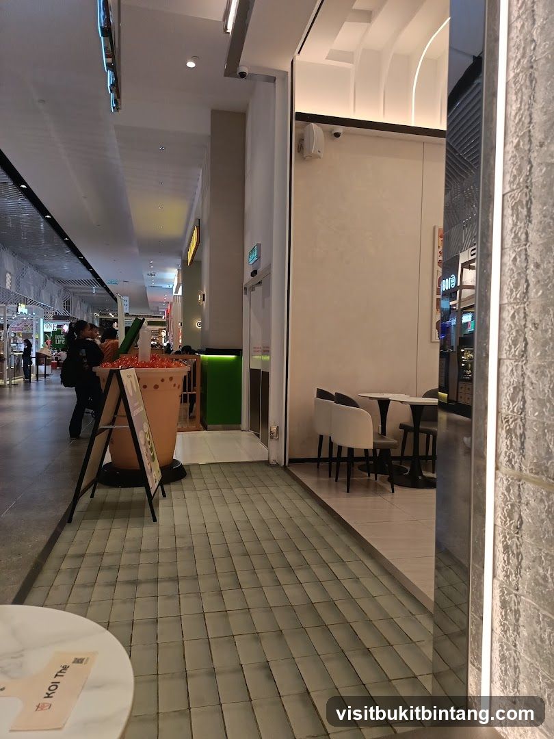 Indoor mall walkway with a bubble tea shop