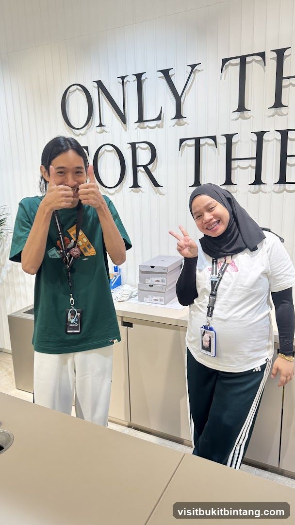 Two people posing in a store