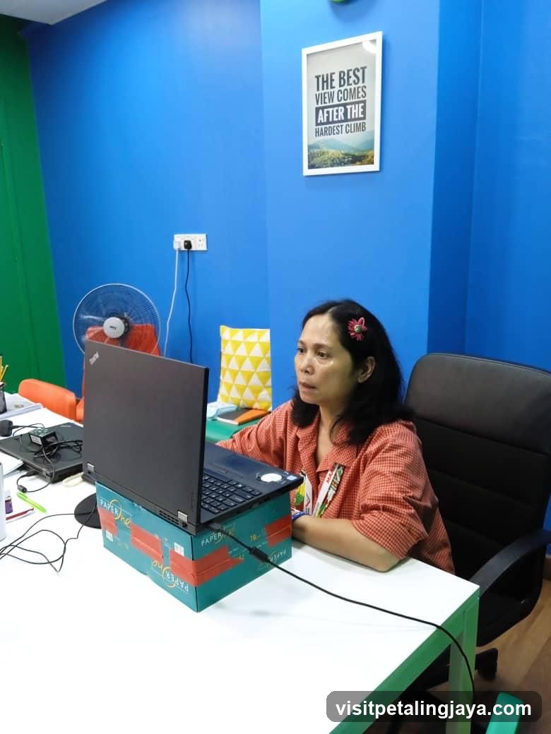 Office Workspace with Laptop on Box