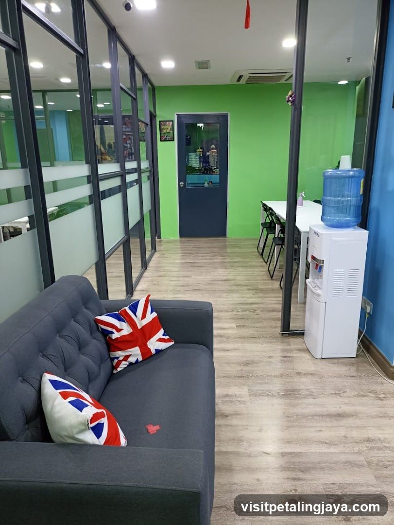 Interior Lounge Area with Green Wall and Water Dispenser