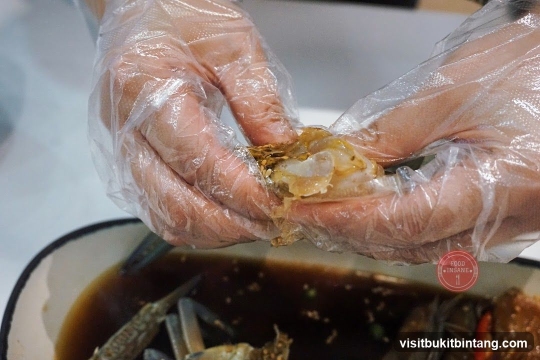 Hands preparing crab