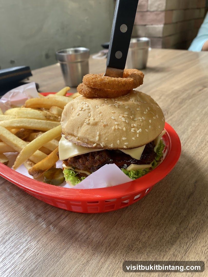 Burger with Onion Rings and Fries